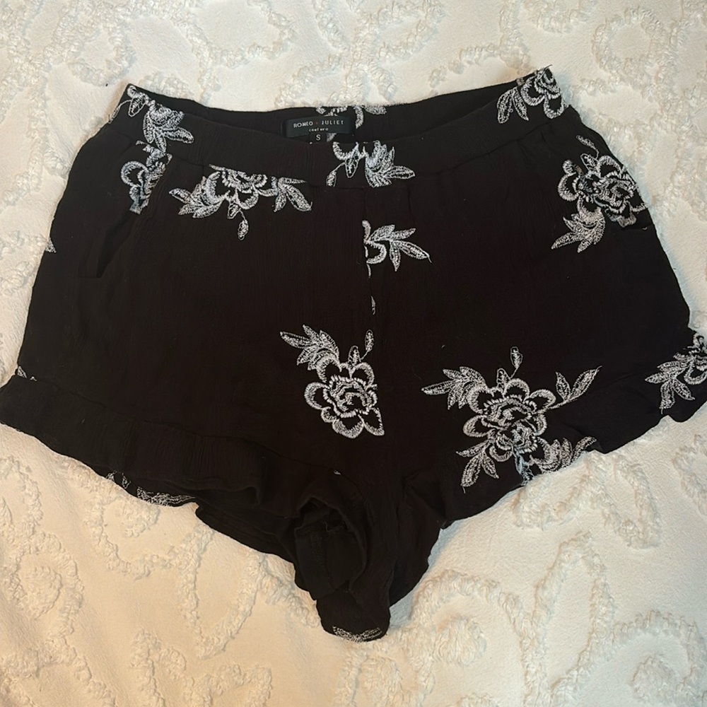 Very cute black with white embroidery shorts with ruffle detail.